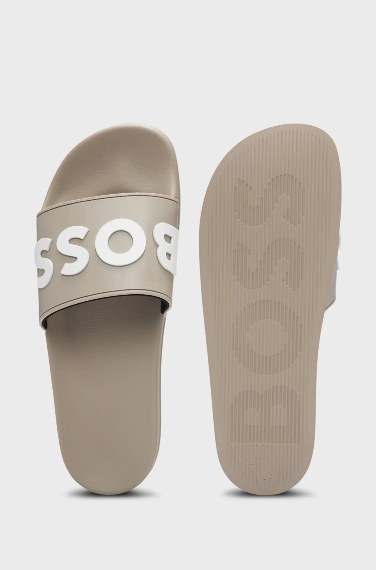 italiensk_fremstillede_badesandaler_med_hvet_logo_5.webp HUGO BOSS Italiensk Fremstillede Badesandaler Med Hævet Logo Lysegrå Sale